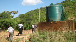 Gravity fed water system connected to a local spring: in Kaombe village (Mpika district) from images on Water, sanitation and hygiene in Zambian schools, photograph courtesy of Jay Graham